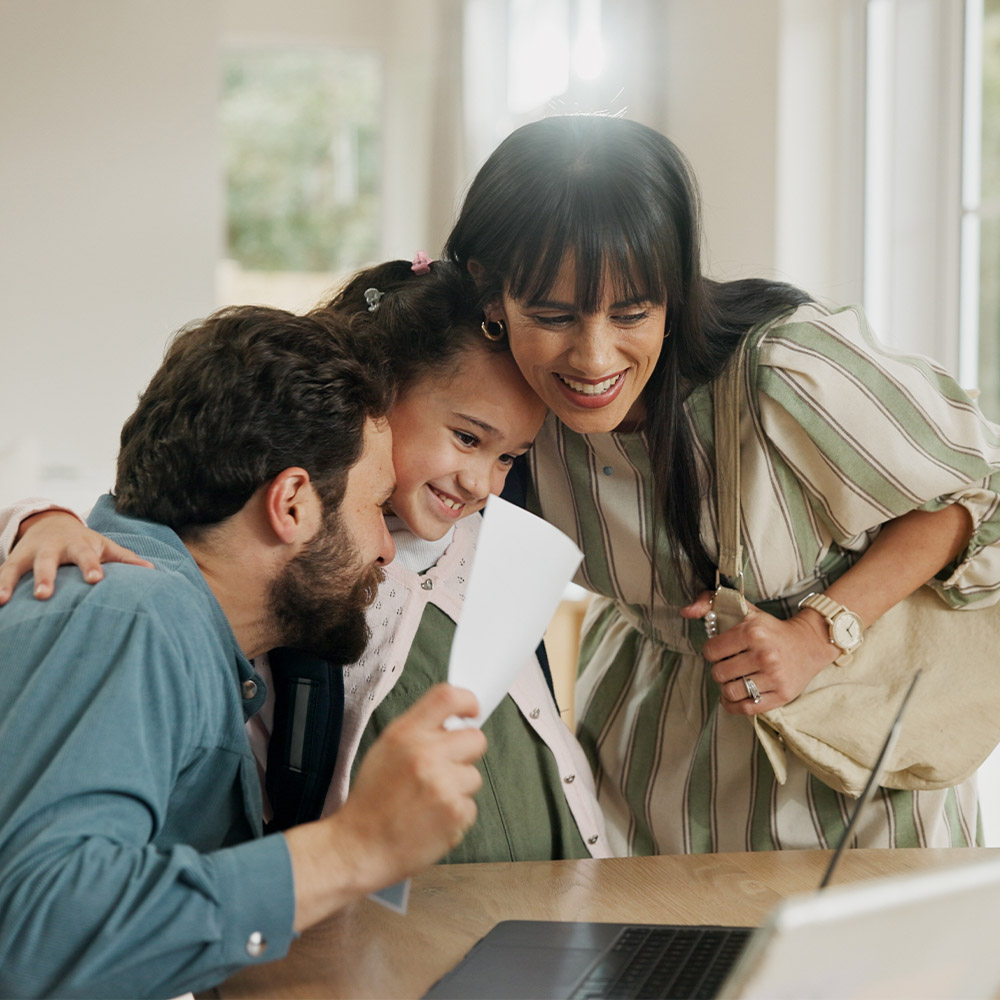 A young family excited over signing documents 