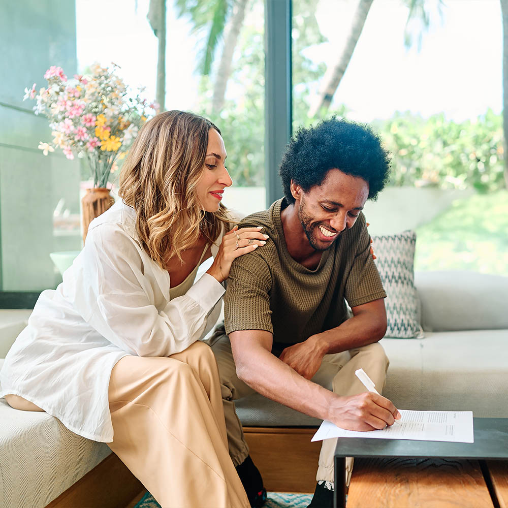 A couple signing a remortgaging contract 